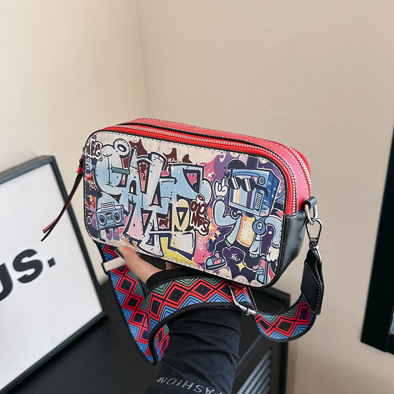 Bolso cuadrado pequeño estilo explosivo transfronterizo, graffiti de personalidad femenina, bolso puenting, bolso de cámara con correa de hombro ancha de moda, bolso de mensajero de hombro de todo fósforo