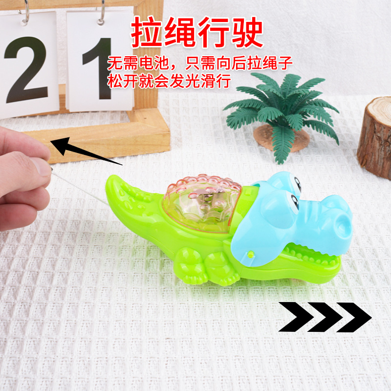 Hilo de tracción creativo, cabello luminoso, dibujos animados de cocodrilo, lindo y divertido, tirón de cuerda, puesto de cocodrilo flash, juguetes para niños de azúcar al por mayor