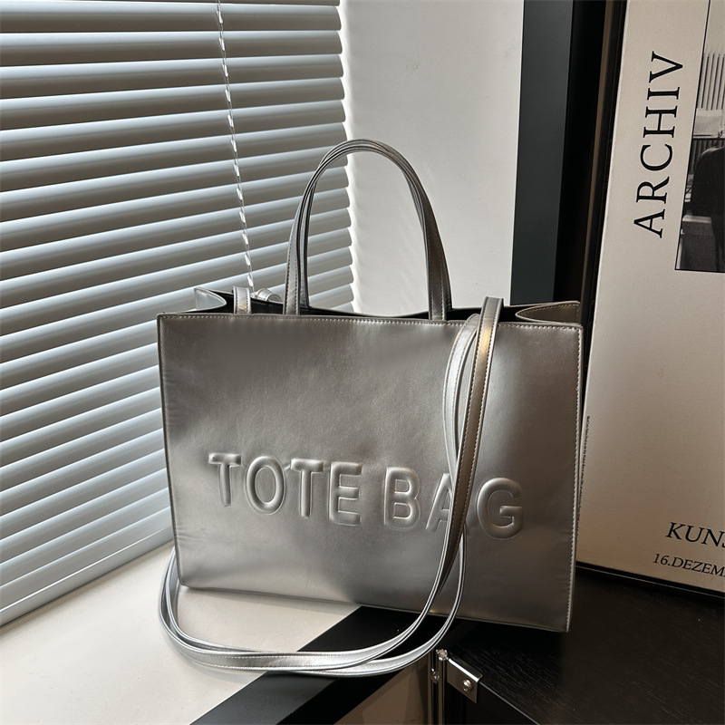 2024 nueva gran capacidad simple mochila de hombro texturizada bolso de mano letras de impresión clase viaje bolsa de mano