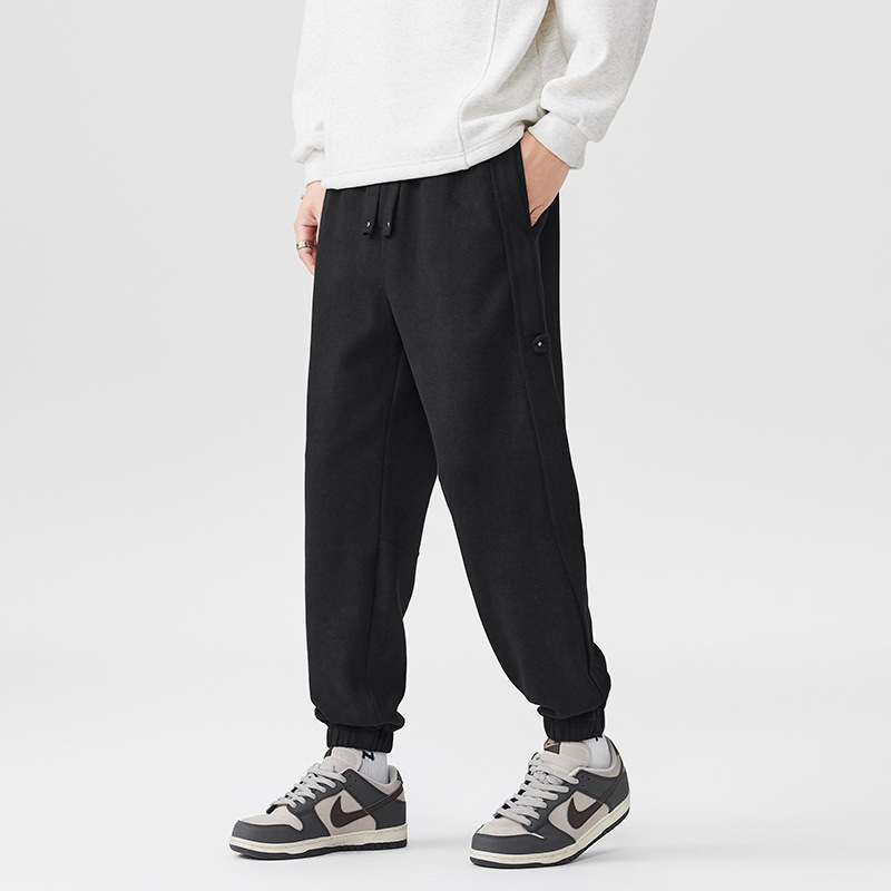 2025 otoño y invierno nuevos pantalones negros para hombres sueltos pantalones deportivos casuales de cintura elástica de tamaño grande con etiquetas colgantes image 1