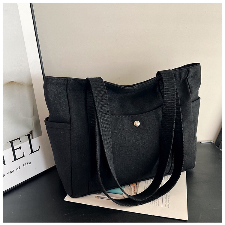 Wholesale of new women's single-shoulder bags, cross-border simple and casual canvas bags, Korean version LOGO printed commuter tote bags undefined