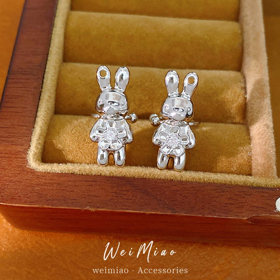 Flores de piedra de piedra de conejo orejas para mujeres sin agujeros de orejas personalidad fría pendientes de viento ligero lujo alta sensación de auriculares al por mayor