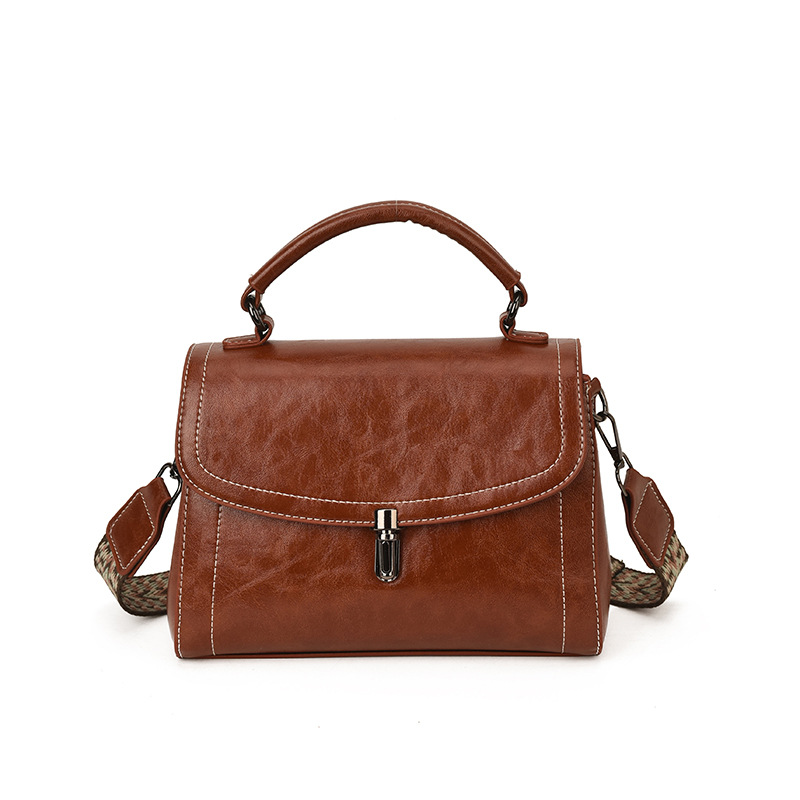 Bagos populares de alta sensación para mujeres 2025, nuevo otoño y invierno retro de banda ancha, bolsos de mano casuales, bolsos de mano.