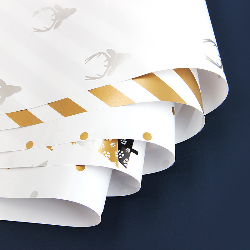 Papel de regalo de navidad transfronterizo caja de regalo de cumpleaños de san valentín papel de embalaje de lunares papel de regalo al por mayor