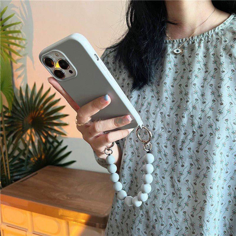 Cáscara de teléfono móvil iphone15 diagonal portátil de color sólido 16ProMax simple y elegante para Apple 14 nueva mujer 13