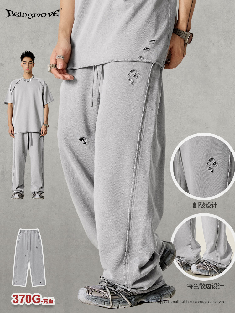 2025 primavera Europa y América de la calle alta borde agujero pantalones de piernas anchas pantalones largos casuales sueltos para hacer pantalones de lavandería de agua viejos para hombres