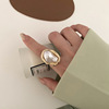 Retro fashionable design ring from pearl, French retro style, on index finger