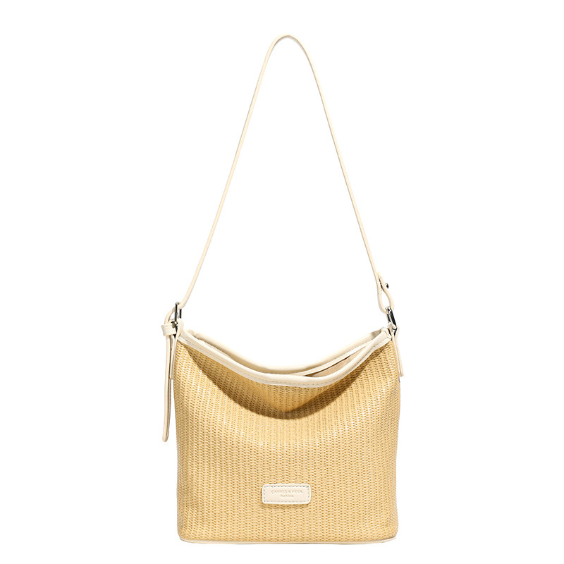 Verano nuevo estilo 2025 commuter vacaciones viento cubo bolso de hombro de estilo occidental de moda femenina bolso de mensajero de alta gama de nicho