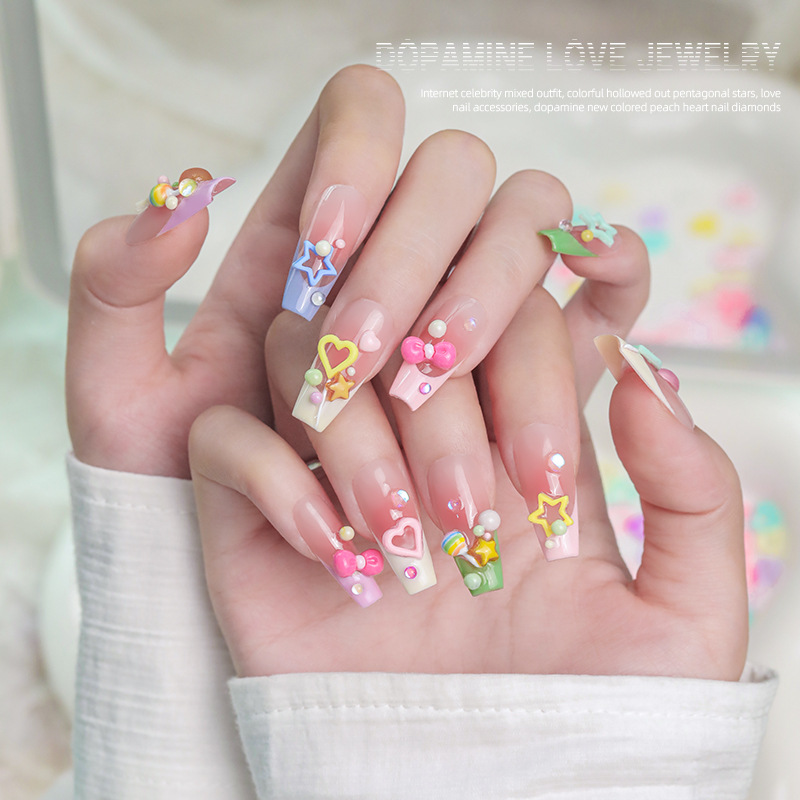Red en línea mezcla hueco de color dopamina pentagonal amor joyas de uñas joyas de uñas de corazón de桃ar al por mayor