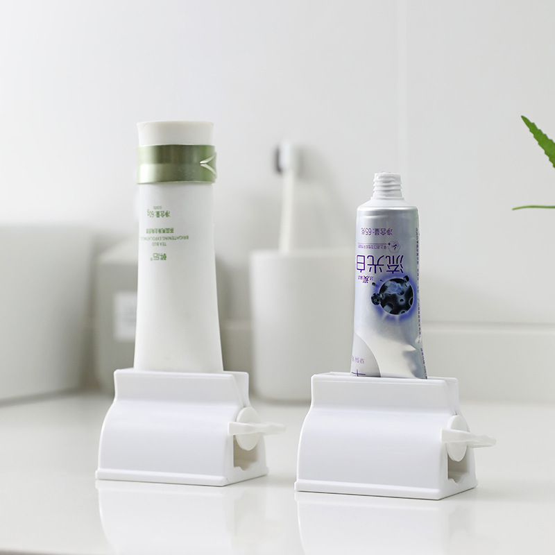 Japanese creative toothpaste squeezer facial cleanser storage rack children's toothpaste clip lazy manual toothpaste artifact