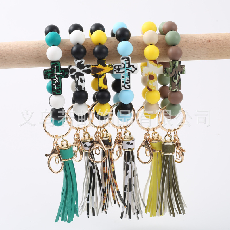 European and American cross-border hot selling beaded silicone cross leopard wood bead bracelet bracelet PU Tassel Keychain