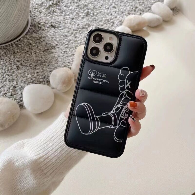 Trendy brand KAWS padded down jacket iPhone 17 case suitable for Apple 15/13/14 Pro Max, shockproof for 16 Trendy brand KAWS padded down jacket iPhone 17 case suitable for Apple 15/13/14 Pro Max, shockproof for 16