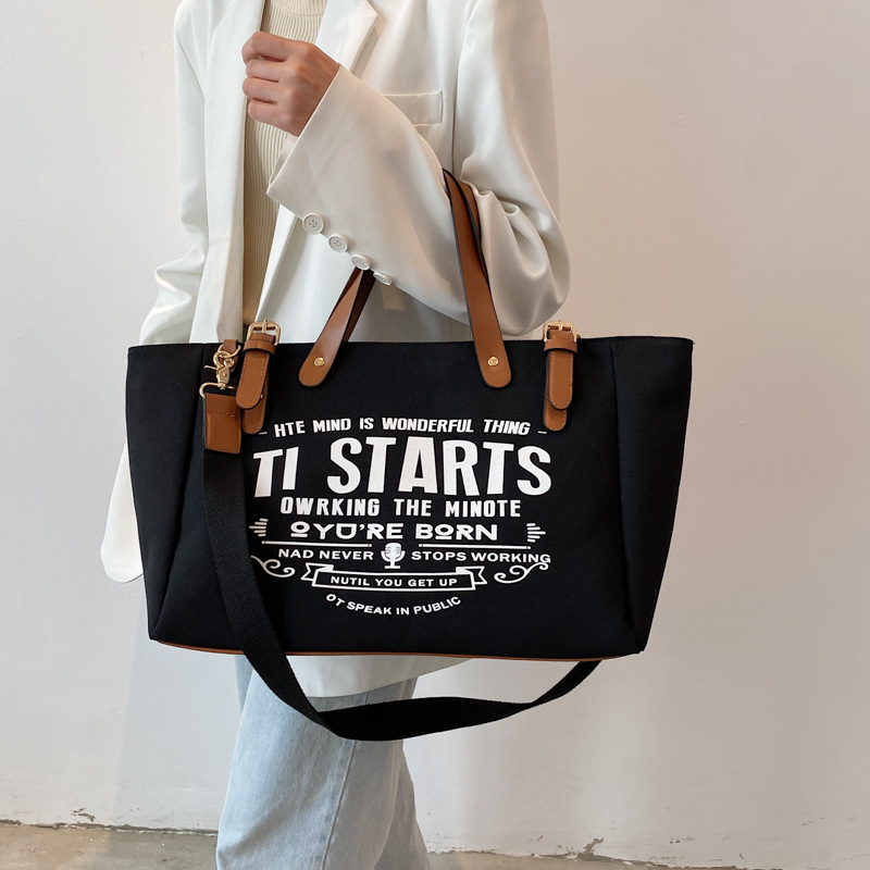 Bolso tote de lona estilo coreano 2025 con letras impresas, bolso de hombro cruzado, bolso tote versátil de gran capacidad.