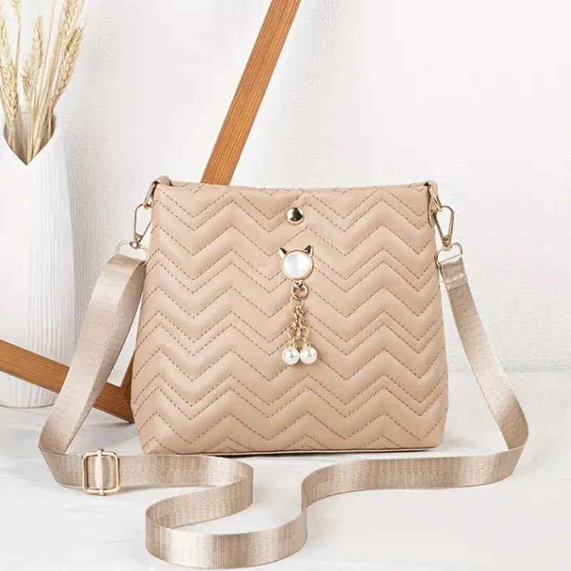 Moda coreana ondulada estriada felina colgante de perlas decoración simple bolsa de mujer mochila al por mayor bolsa image 9