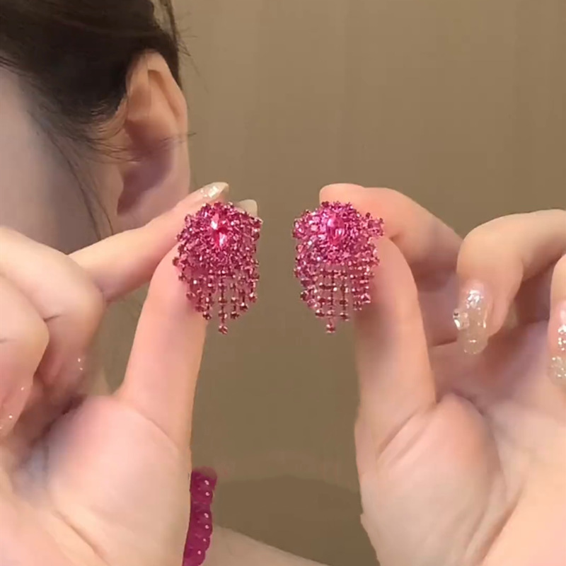 Fashionable fuchsia elegant earrings drop-shaped