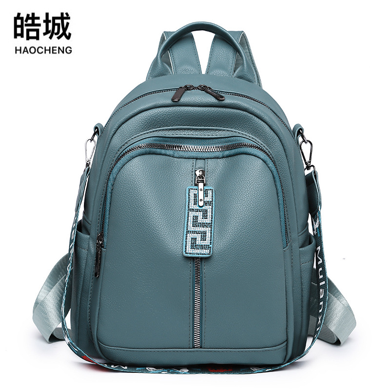 Mochila de sentido de alta gama para mujer 2022 nueva mochila de cuero suave coreana mochila de doble uso de todo fósforo de moda mochila escolar al por mayor