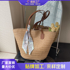 外単草編みバッグ女性2025新型リゾートビーチ草バッグ編み大容量通勤バケツバッグ