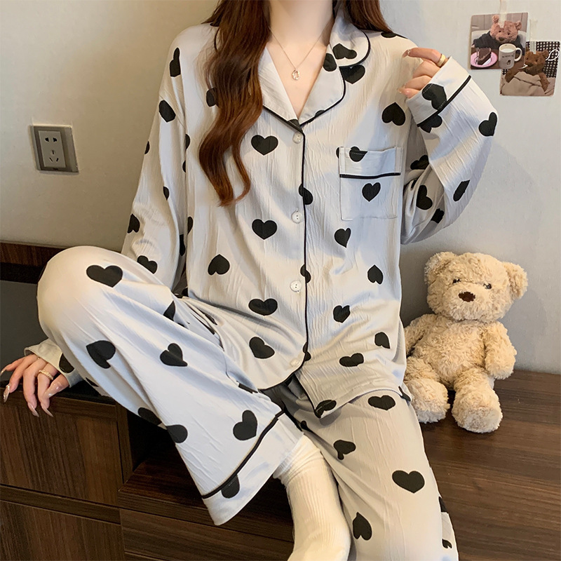 蝶結びのさくらんぼのプリントの女性のパジャマの春と秋の新型のカーディガンの長袖のズボンの部屋の服のスーツは実際に卸売りをたたきます。|undefined