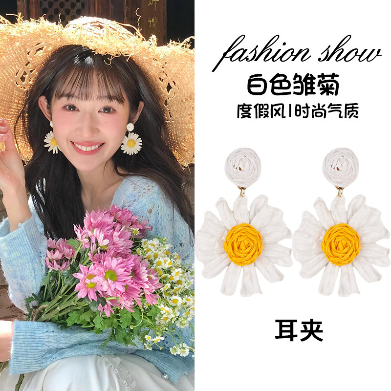 White ear clips, flowered