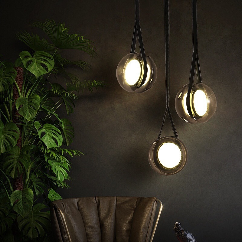 Nordic creative yo-yo belt chandelier Danish designer glass leather restaurant bar minimalist light luxury lamps Nordic creative yo-yo belt chandelier Danish designer glass leather restaurant bar minimalist light luxury lamps