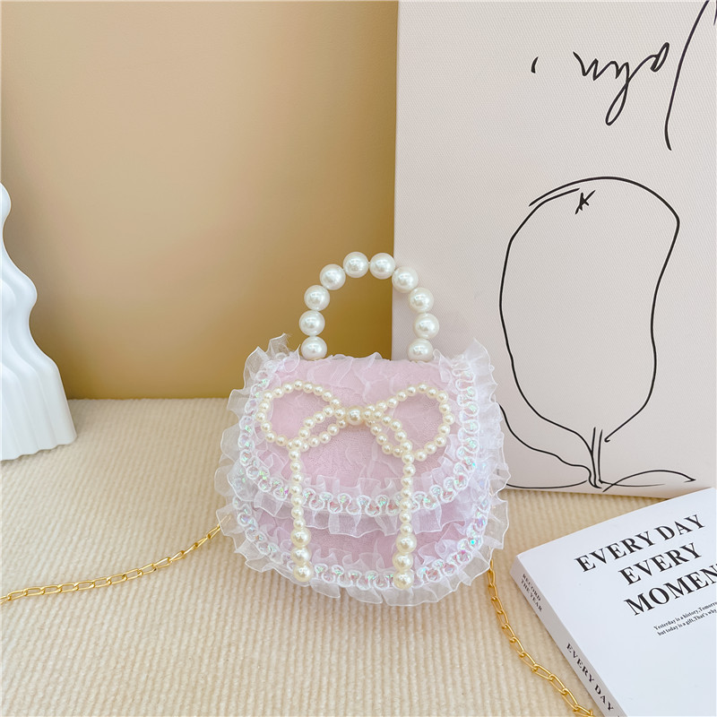 2022 nuevas niñas bolso de perlas de dibujos animados lindo arco princesa bolso de hombro estilo occidental encaje pequeño bolso de hombro