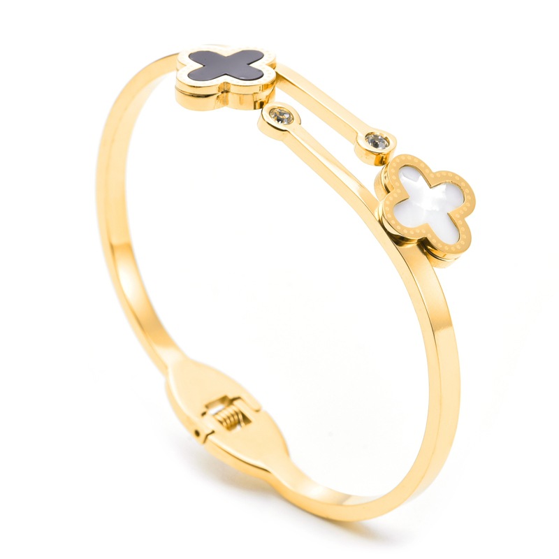 Pulsera de trébol de cuatro hojas en blanco y negro dorado