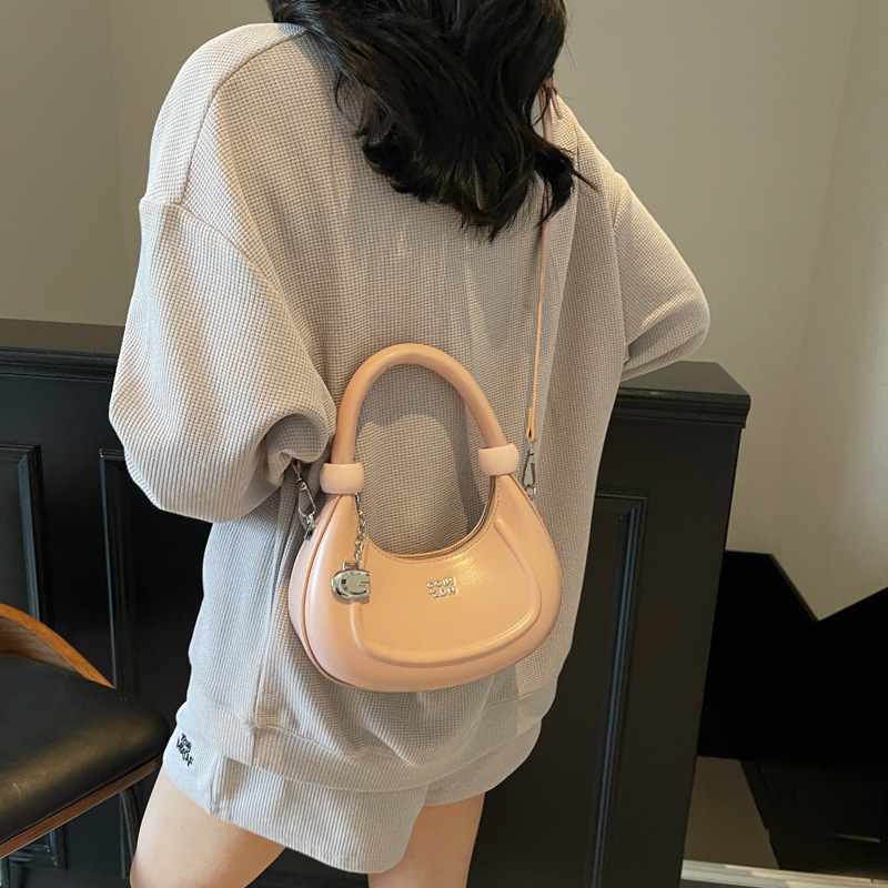Bolsos de diseño de nicho de tendencia transfronteriza para mujer 2025 nuevo bolso de hombro retro salvaje bolso de axila de moda occidental