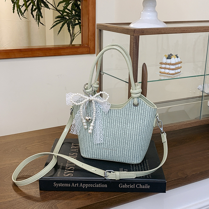 Bolsos de alta gama para mujer 2025 nuevo bolso de cubo popular moda bolso de hombro de todo fósforo bolso de mensajero de cercanías