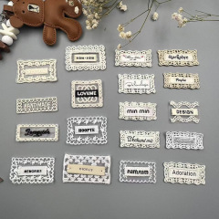 新しいレースの縁のネットの底の布はネットの糸を貼って刺繍して服の靴の帽子の靴下を結び付けてアクセサリの商標の卸売りを飾ります。