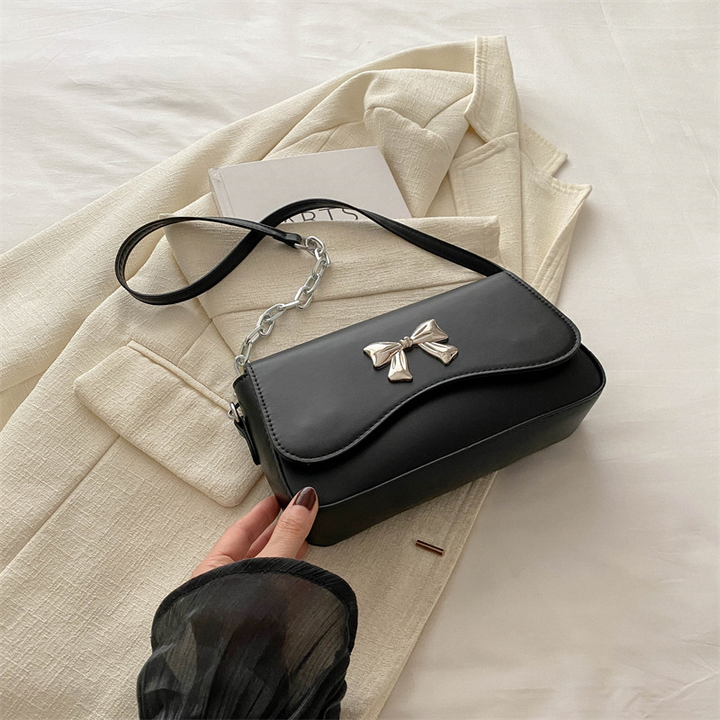 Este año popular bolso de arco para mujeres 2024 nuevo estilo extranjero primavera y verano mini bolso de cadena bolso de mochila