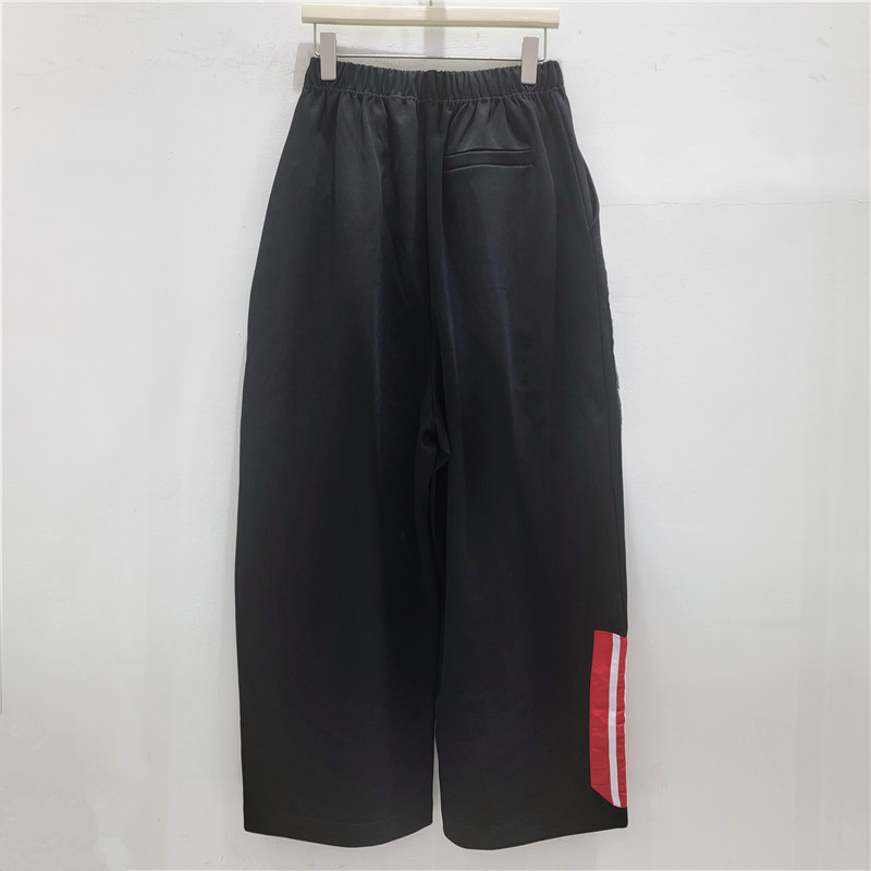 Pantalones de diseño de camuflaje de alta calle americana retro nicho sueltos piernas anchas cintura elástica pantalones largos