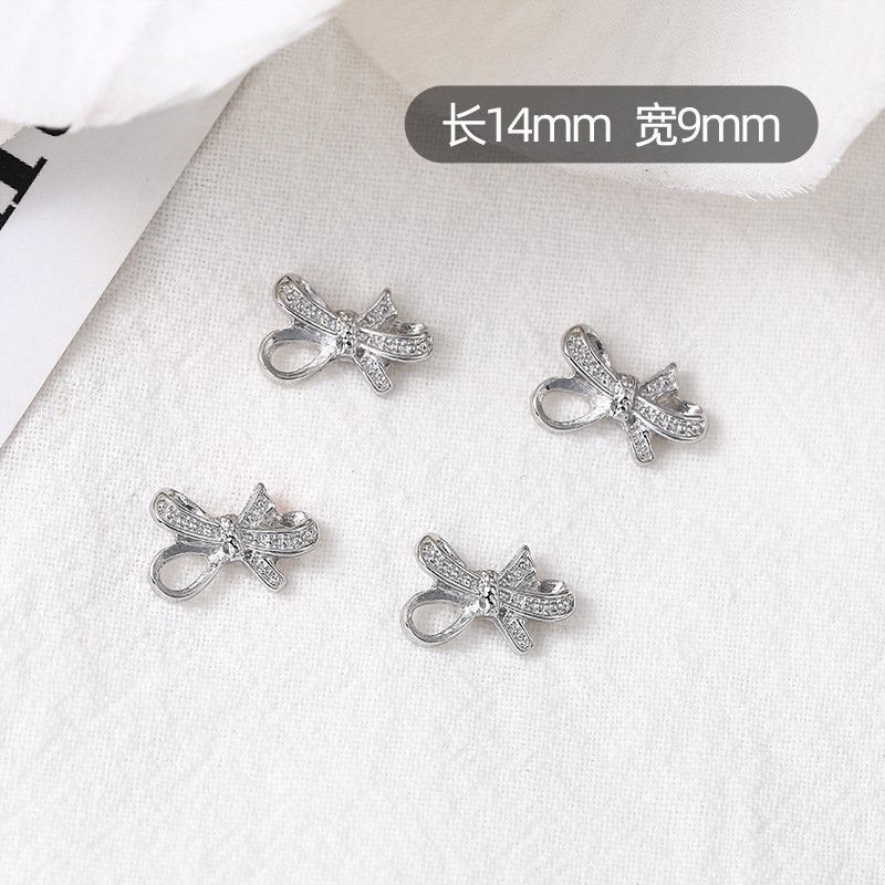 Nueva joyería de uñas, lazo, pajarita de lujo ligero, accesorios de uñas de aleación, accesorios de diamantes de uñas de celebridades de Internet tridimensionales, estilo caliente