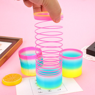 Cross-border stall hot sale medium rainbow ring elastic rainbow ring toy spring color ring jengle hula ring