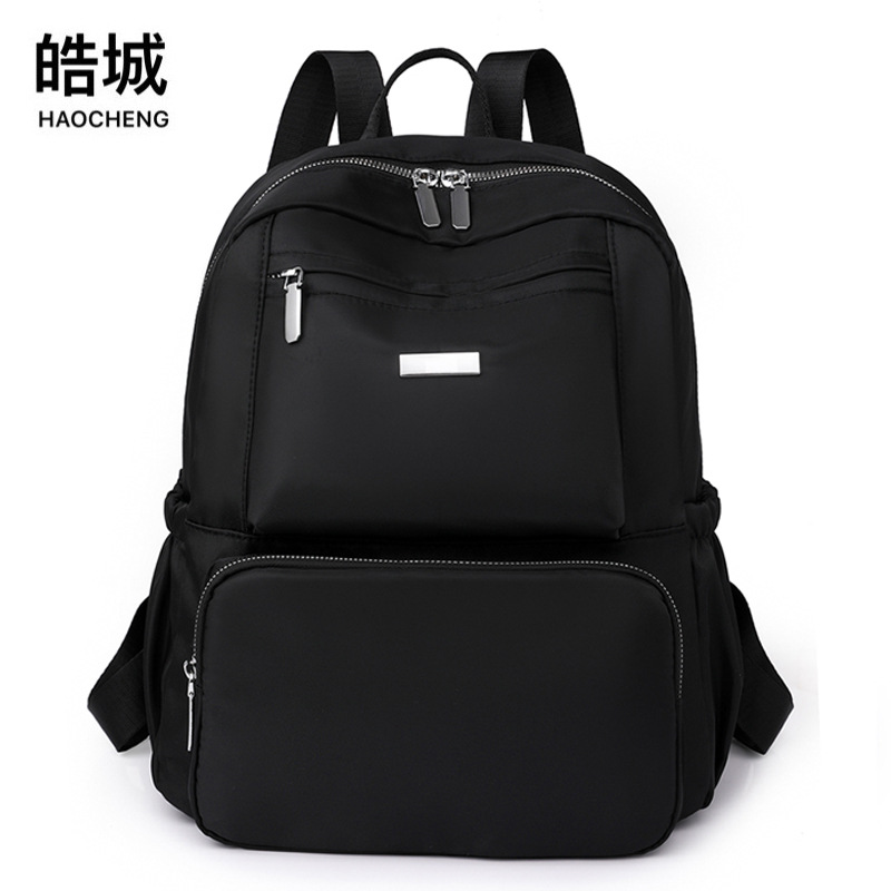 2023 nueva mochila de tela Oxford para mujer casual, color sólido simple, gran capacidad, mochila plegable ligera, mochila escolar de moda