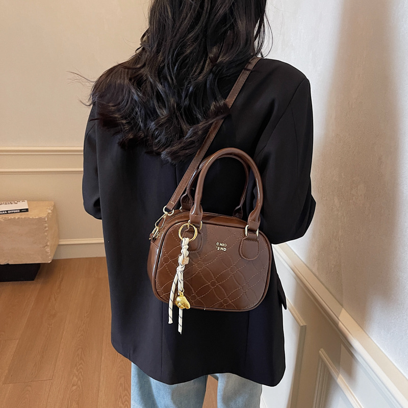 Este año, la popular explosión de bolsos de mano para mujeres 2025, nueva moda universal, bolsos de hombro, bolsos de béisbol de moda de textura