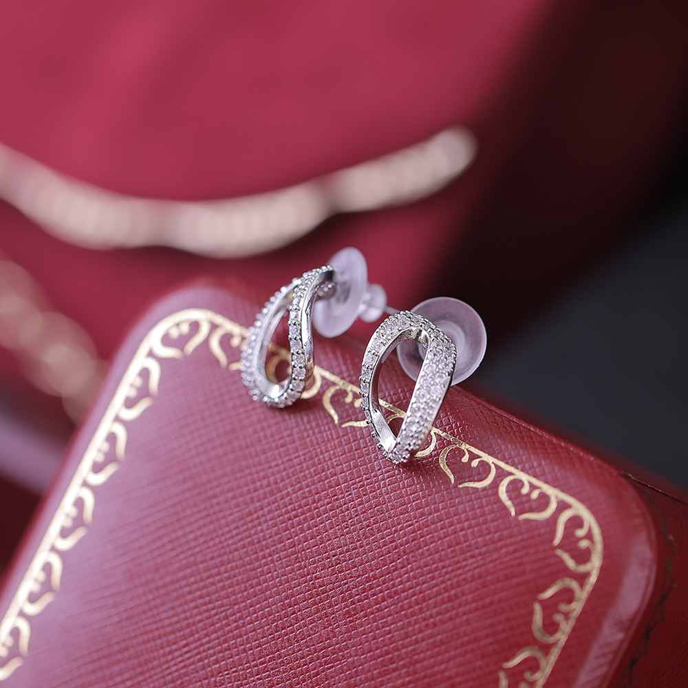 Orecchini bicolore con placcatura in ottone con ago in argento di qualità S che preserva la forma geometrica con micro intarsi in zircone_voghion.com