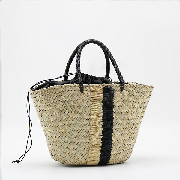 handheld straw blue black woven aquatic plants