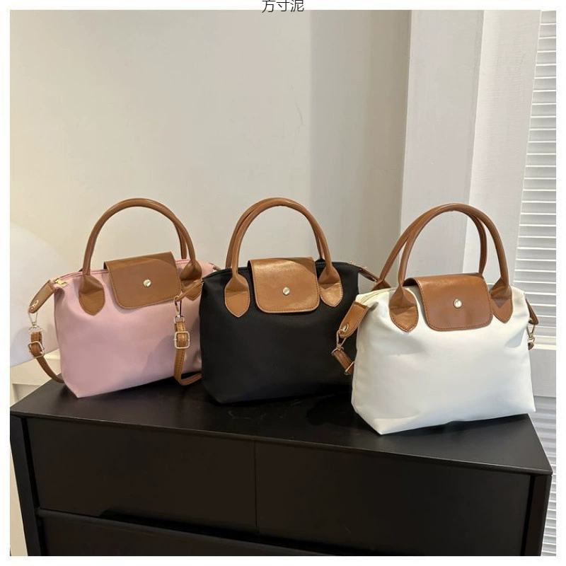 Осенние и зимние наклоны для коммутирующих большой емкости Оксфорд холст сумка для женщин 2025 новые сумки для пельменей