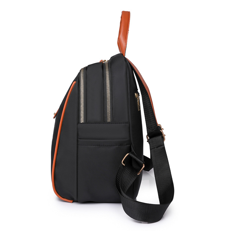 Mochila de nailon para mujer 2024 nueva moda anti-salpicaduras para mujer mochila de concha estilo occidental bolso de viaje de ocio