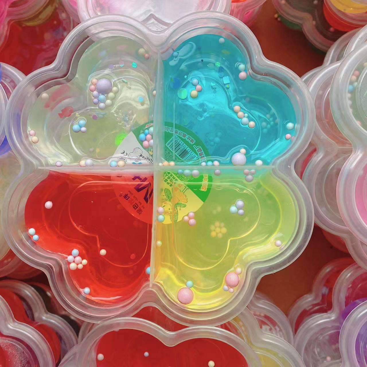 Barro de cristal de cuatro hojas de barro de cristal de ciencia y educación goma espumante slime 4 colores para niños diy alta transparencia 4 cuadros 2 yuanes lotes de departamentos
