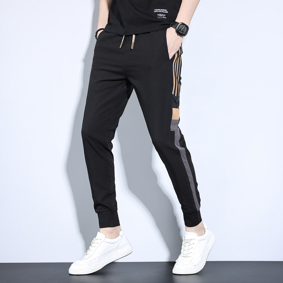 Pantalones deportivos de primavera y otoño sueltos para hombres 2023 nuevos pantalones largos casuales versátiles marca de moda de primavera pantalones harén atados al tobillo