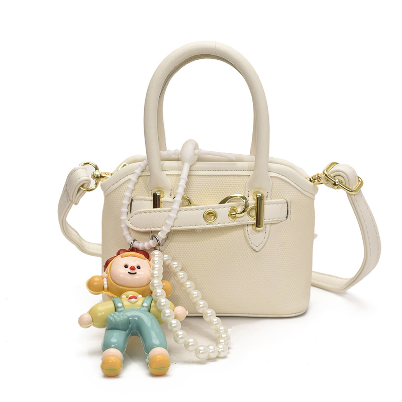 Bolsos de mano para niños lindos colgantes extranjeros mini bolsos de hombro para niños y niñas de color sólido simple bolsos de conchas de niños de moda