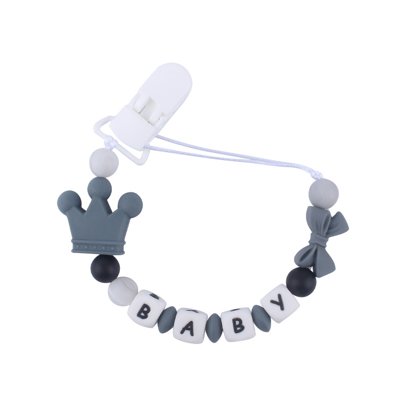 Suministros de bebé corona de dibujos animados cadena anti-gota bebé creativo DIY silicona mordedura pegamento molar chupete cadena