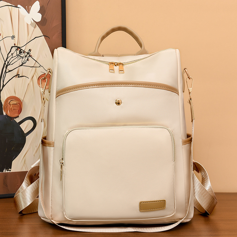 Mochila de tela Oxford nueva transfronteriza para mujer Mochila de moda estilo coreano retro mochila de viaje de moda con remaches simples