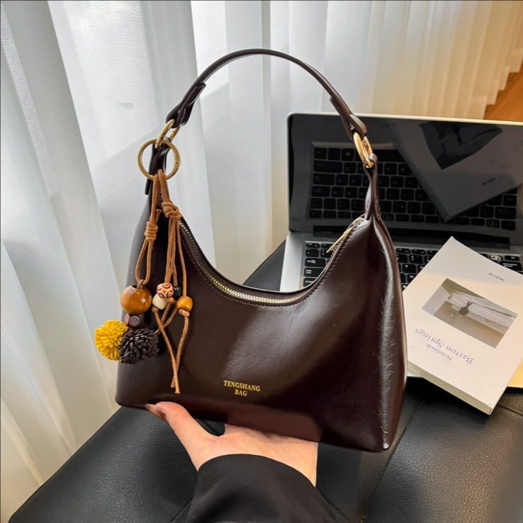 Bolsa de cena portátil de moda ligera de lujo, bolso de hombro de alta calidad de mujer, bolso de brazo de hombro de 2025 nuevo tipo de bolso de hombro de viaje