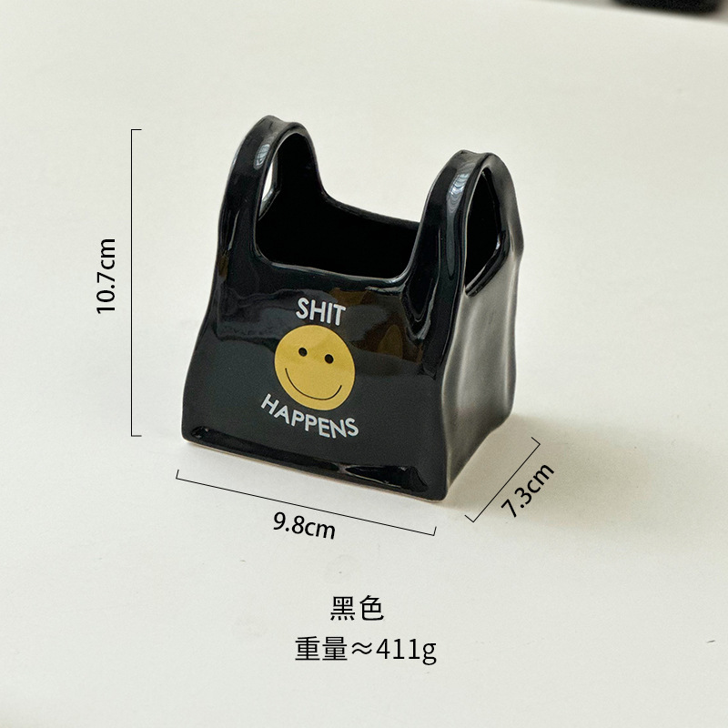 個性的な手は袋のデスクトップのアイデアの陶磁器の筆筒のリモコンの文房具の収納箱の化粧の筆の収納の桶の小さい置物をつまみます。|undefined