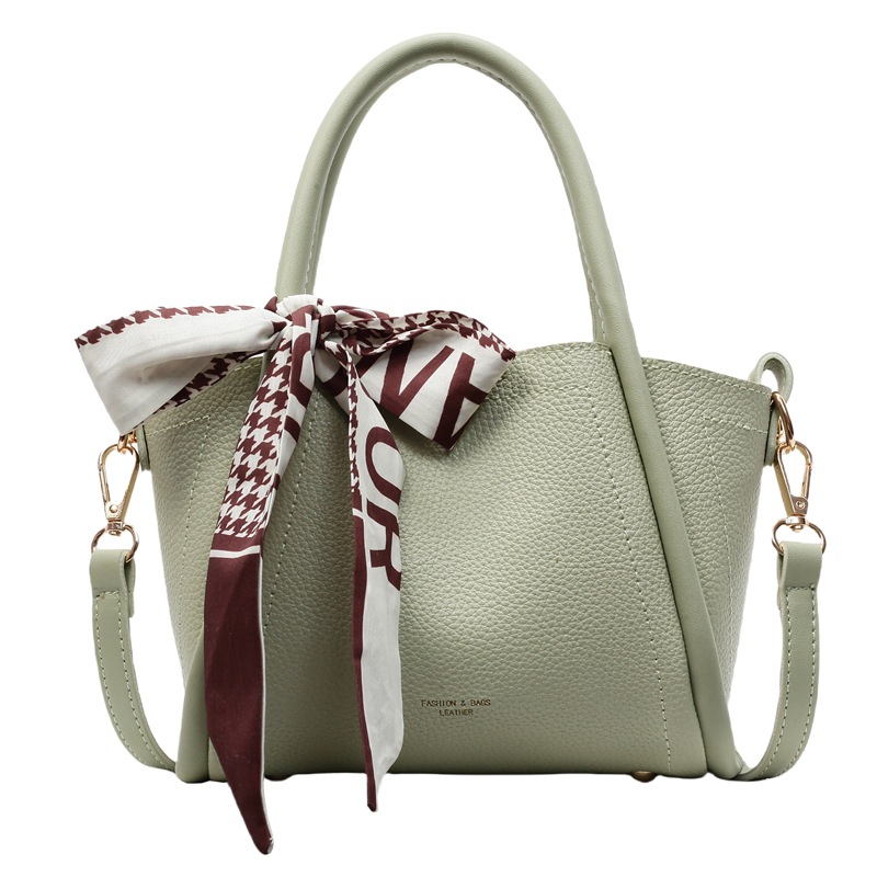 Bolso de cubo con patrón de lichi de alta gama para mujer 2025 nueva tendencia bolso de mensajero de todo fósforo casual bolso de cubo hembra portátil