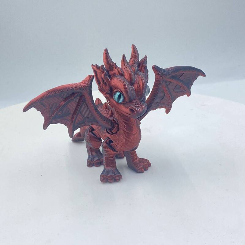 3Dプリントされたかわいい西洋のドラゴンの羽と尾は縮めたり動かしたりできる関節が付いており、子供向けのギフト、おもちゃ、モデルの装飾品です。|undefined