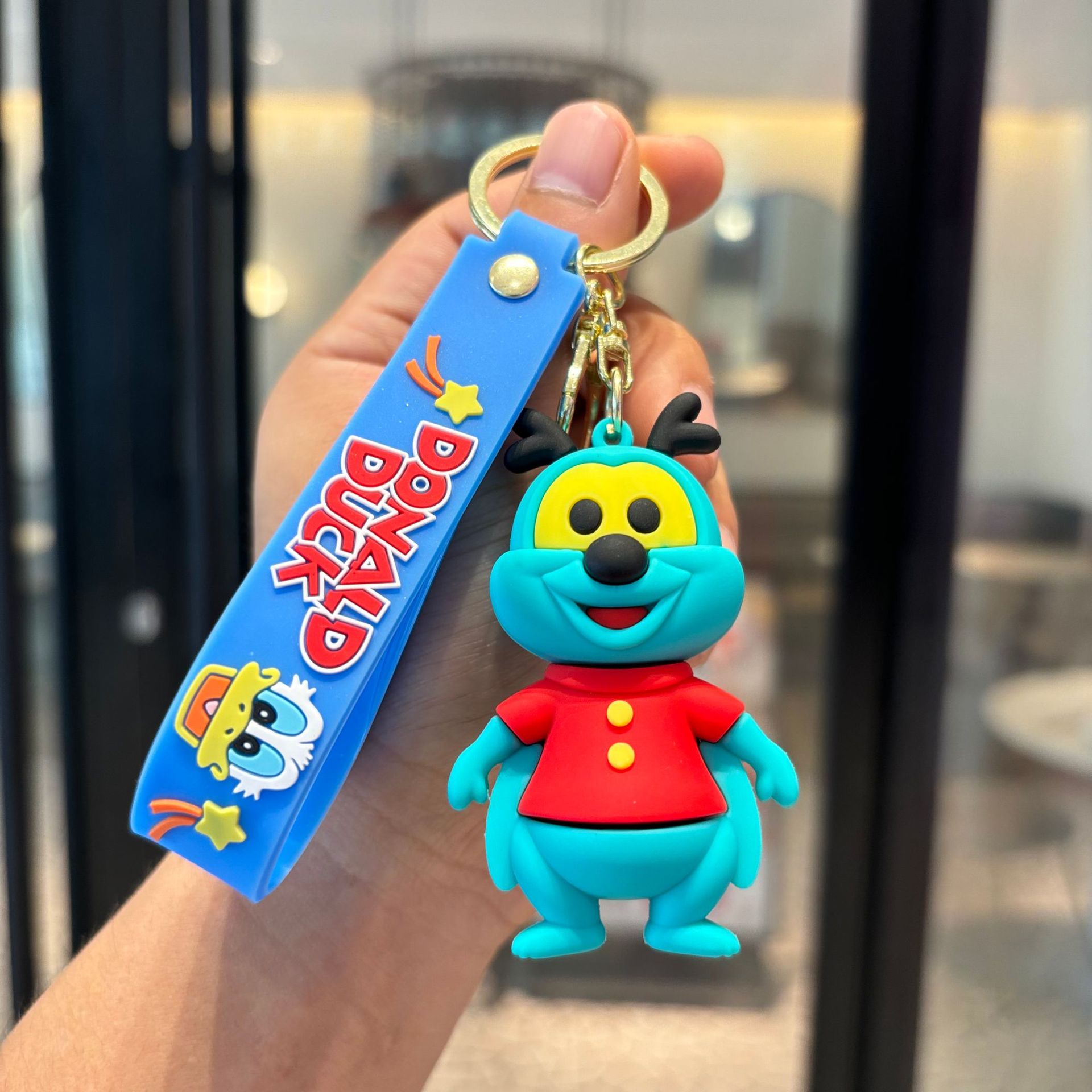 Llavero de pato Donald - gusano rojo