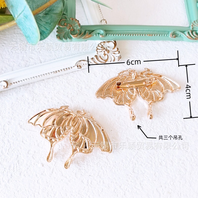 Moth and butterfly brooch